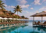 Resort pool with palm trees and beach umbrellas