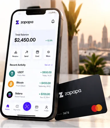 Zapapa app showing a $2,450.00 balance on a phone, leaning on a black Zapapa card on a sunny terrace